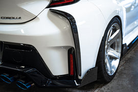 TOM'S Racing - Carbon Fiber Rear Bumper Garnish - Toyota GR Corolla [2023+]