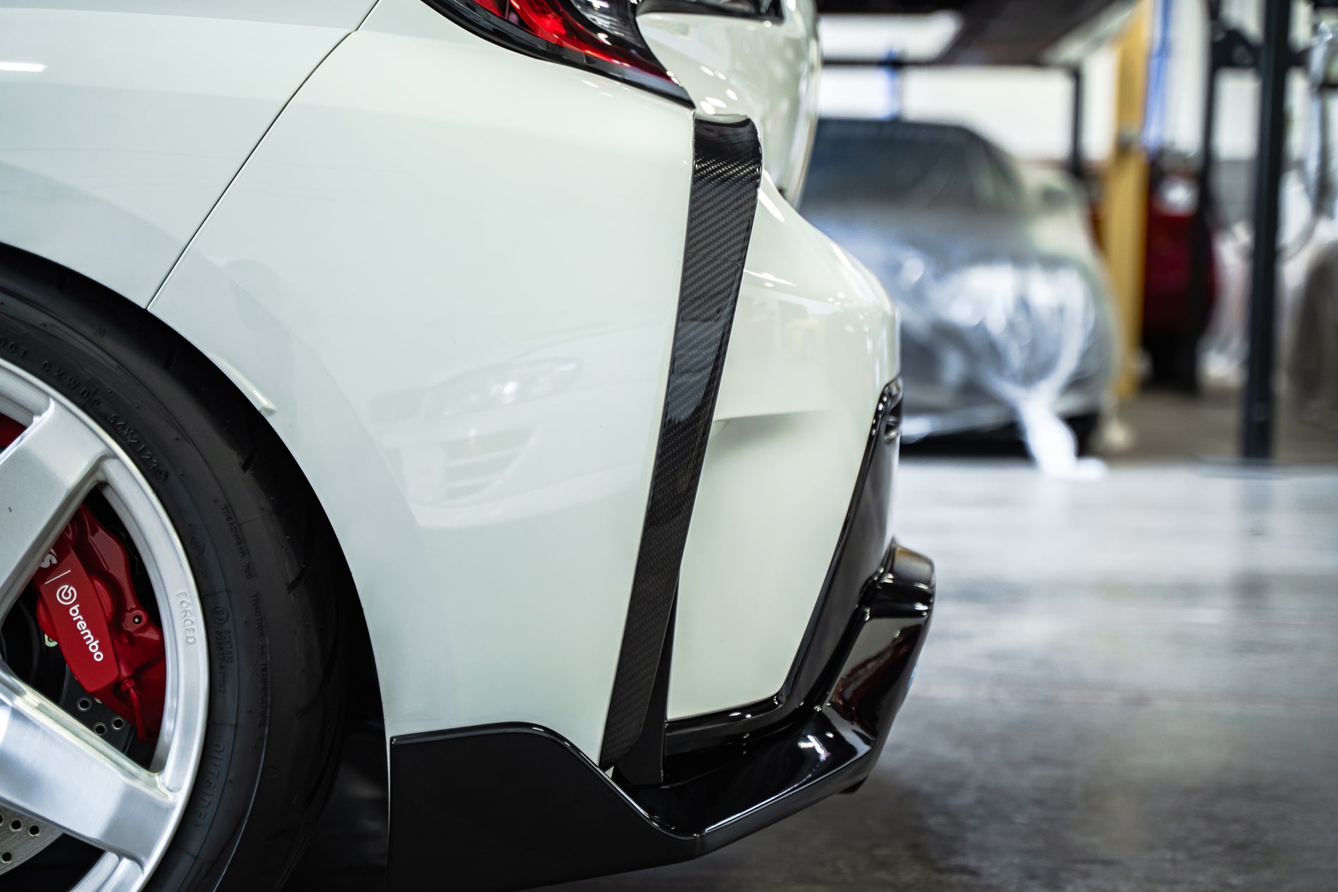 TOM'S Racing - Carbon Fiber Rear Bumper Garnish - Toyota GR