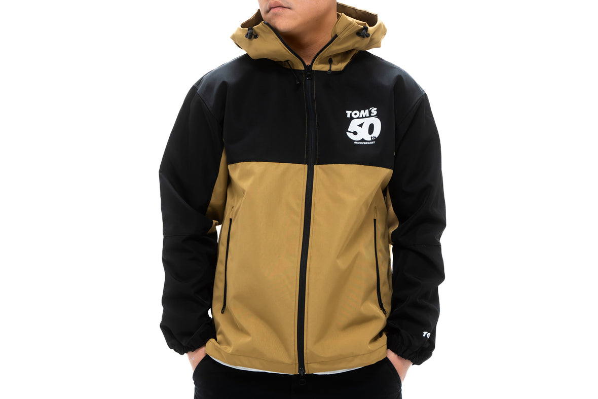TOM'S Racing - 50th Anniversary Windbreaker Jacket - Black w/ Brown ...